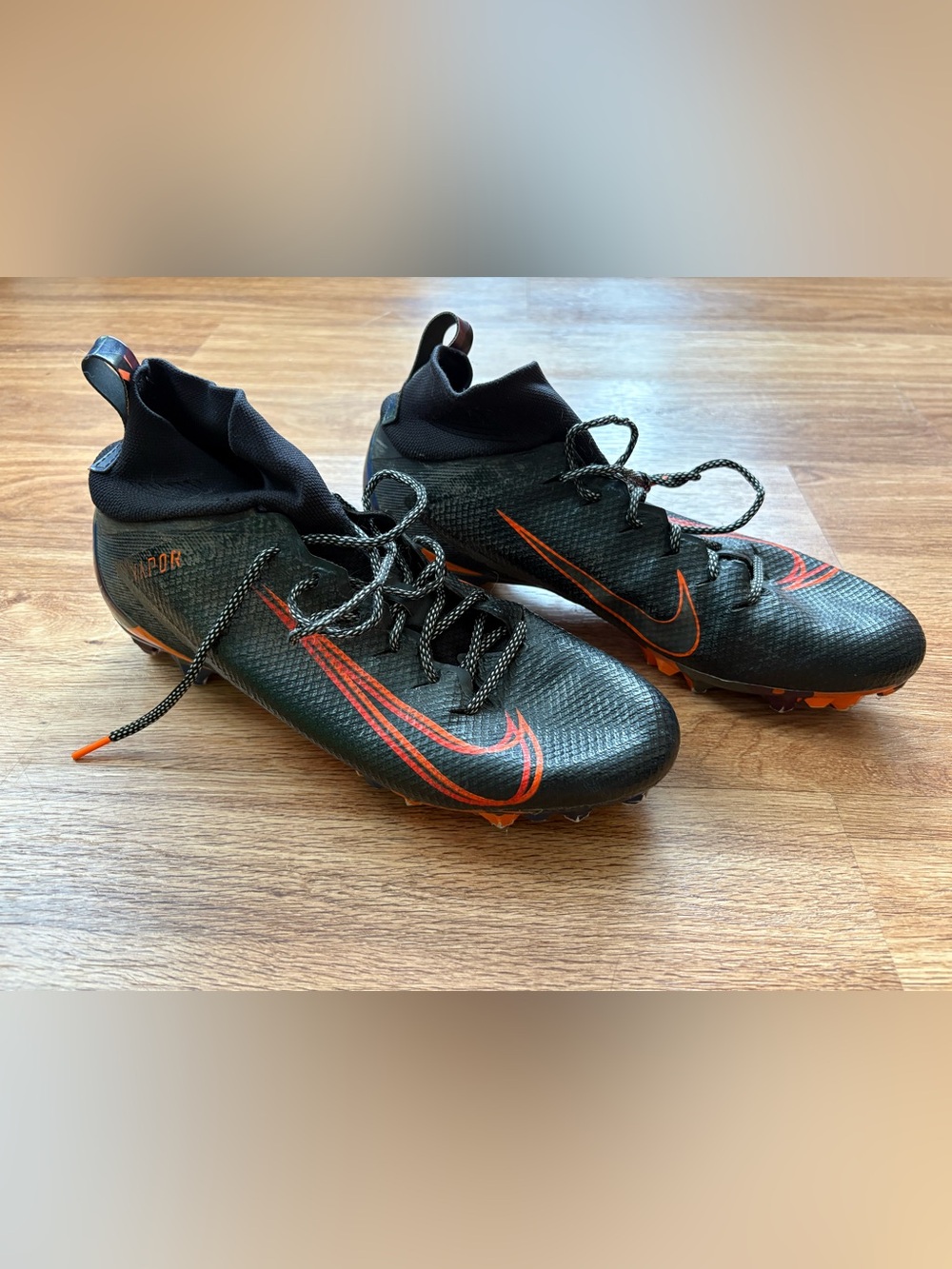 Nike Men’s Black and Orange Cleats